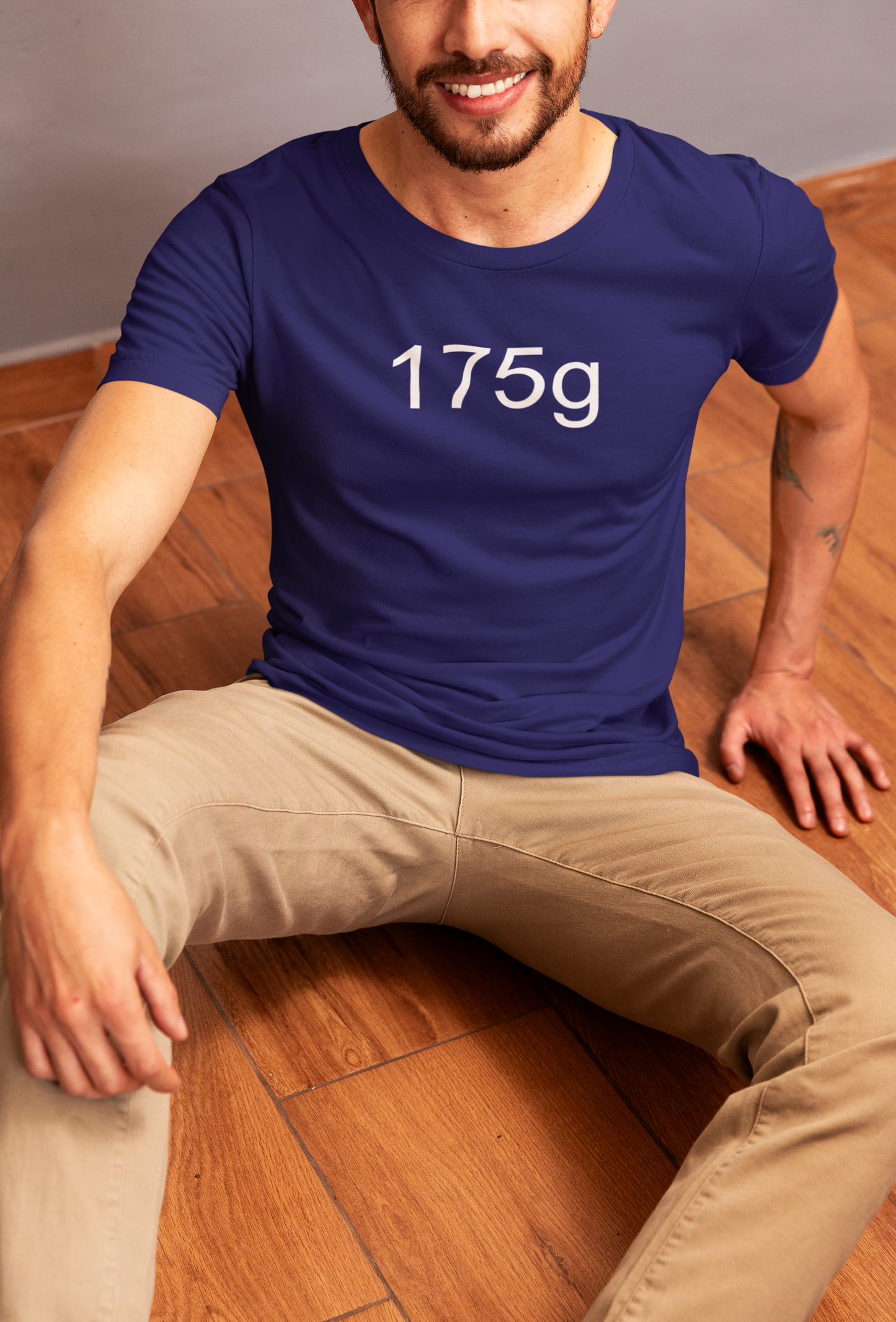 a young man wearing 175g ultimate frisbee shirt with caption 175g