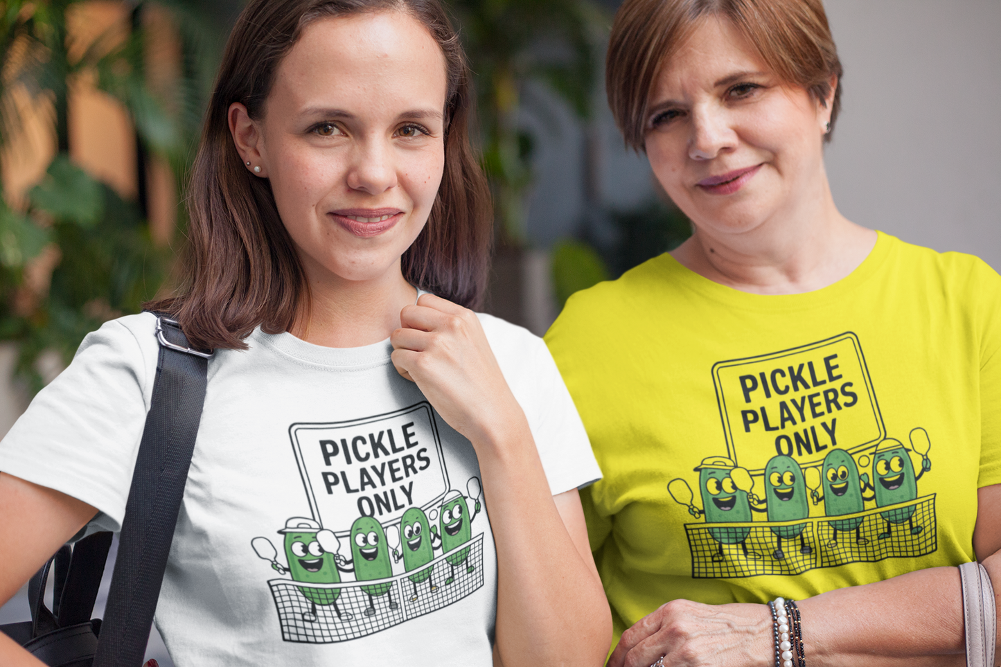 a mother/ daughter sporting a t shirt with pickles lined up playing pickleball with the slogan Pickle Players Only