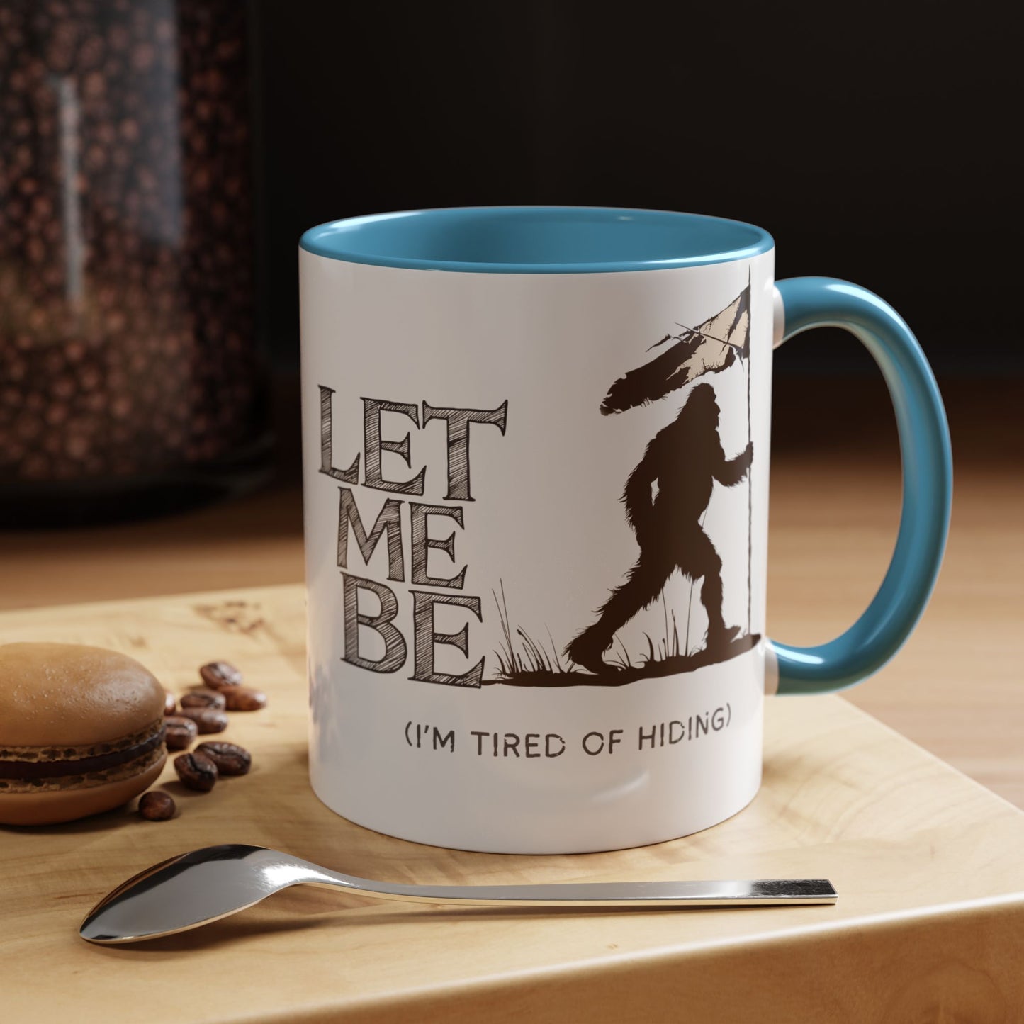a coffee mug on table bigfoot is roaming the woods with the caption Let Me Be I'm Tired Of Hiding