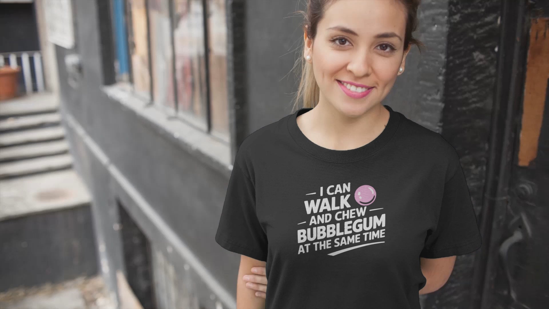 a sporty girl wears vido smiling with teacher a t-shirt that reads I Can Walk And Chew Bubblegum At The Same Time. G