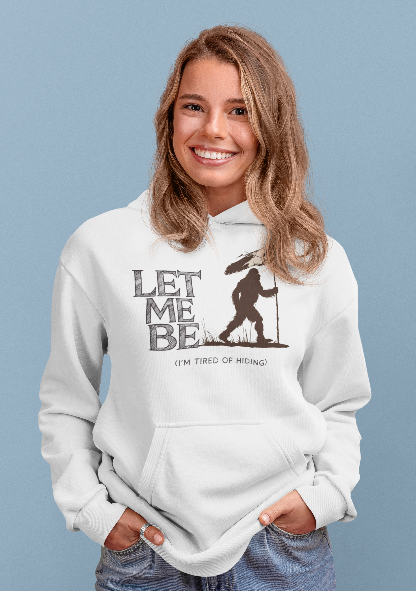 a woman sporting a hoodie with bigfoot surrendering with white flag with the caption Let Me Be I'm Tired Of Hiding