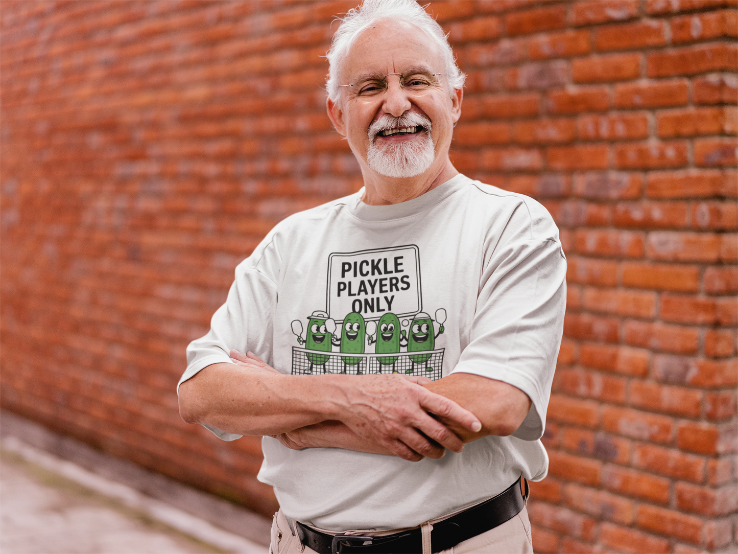 a senior sporting a t shirt with pickles lined up playing pickleball with the slogan Pickle Players Only