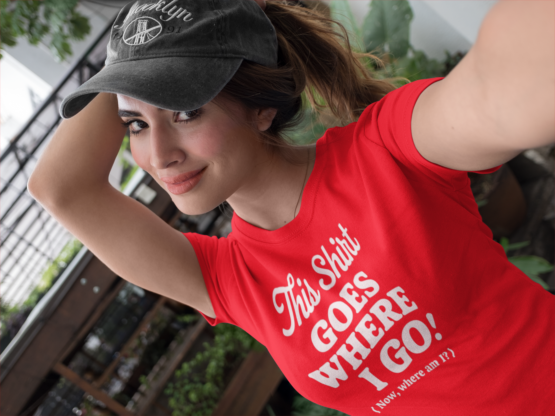a pretty girl wearing a funny t-shirt with slogan This Shirt Goes Where I Go - Now Where Am I?