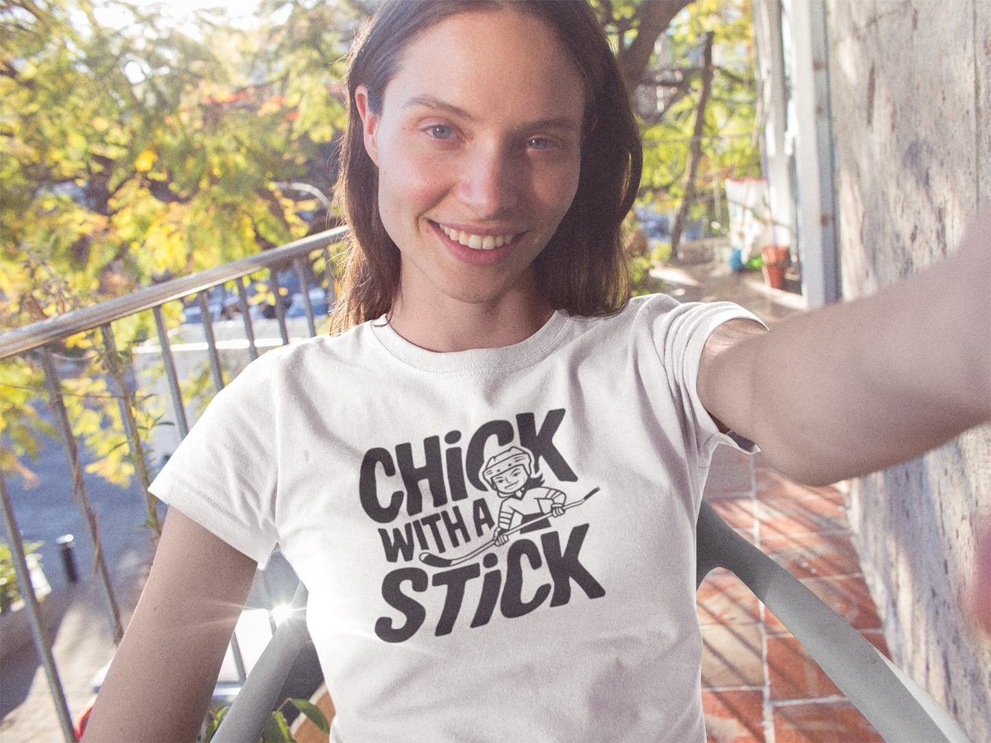 a cool girl wearing a t shirt of girl holding a hockey stick with the caption Chick With A Stick