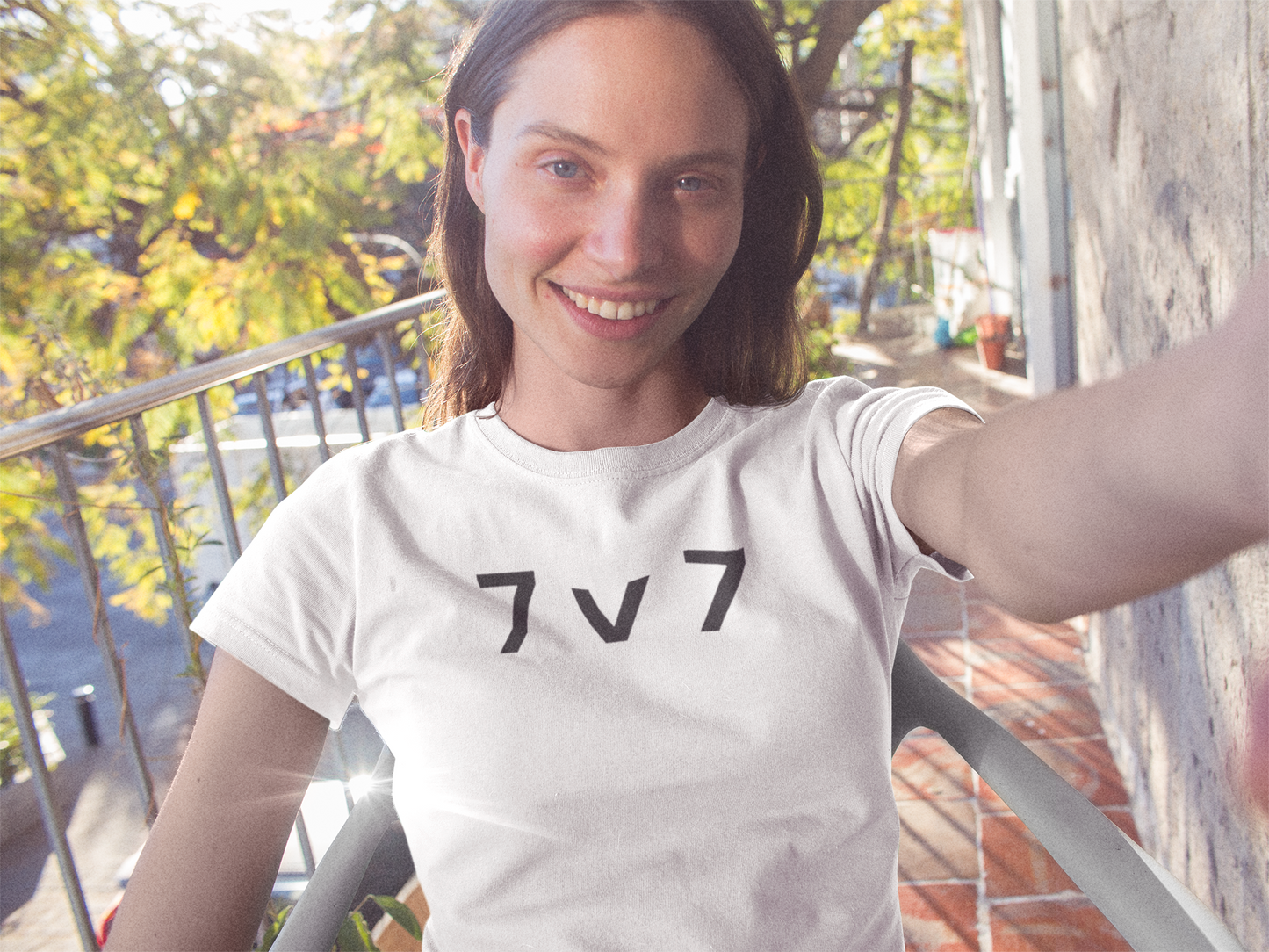 a woman wearing a 7 v 7 ultimate frisbee shirt with caption 7 v 7