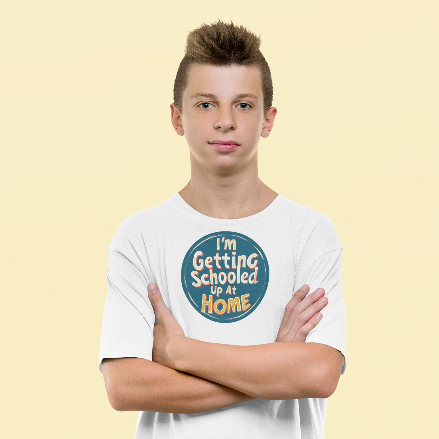 a young man wearing a retro design shirt with the logo I'm Getting Schooled Up At Home