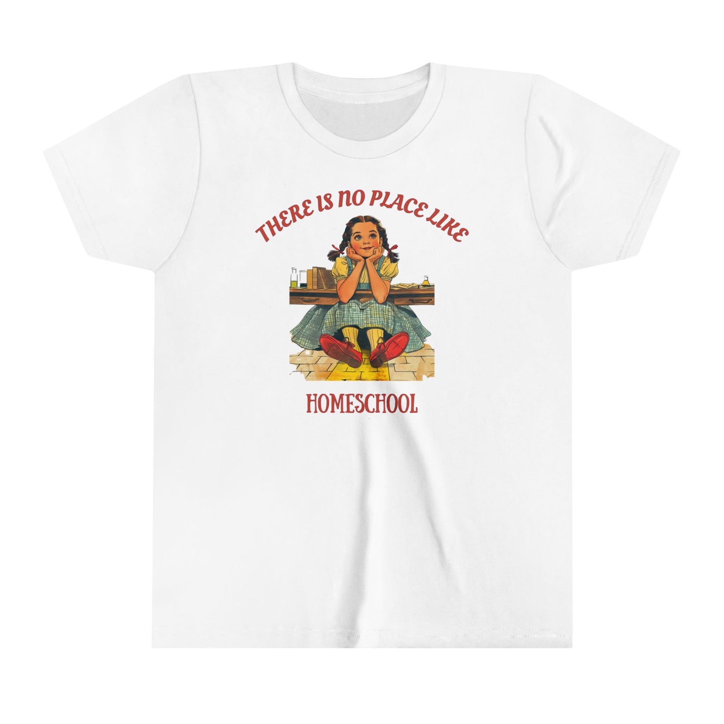 a kids t shirt a girl smiling above golden bricks with the slogan there is no place like homeschool