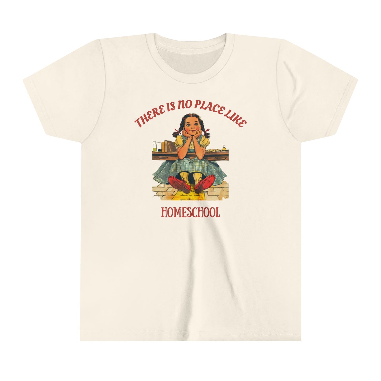 a kids t shirt a girl smiling above golden bricks with the slogan there is no place like homeschool