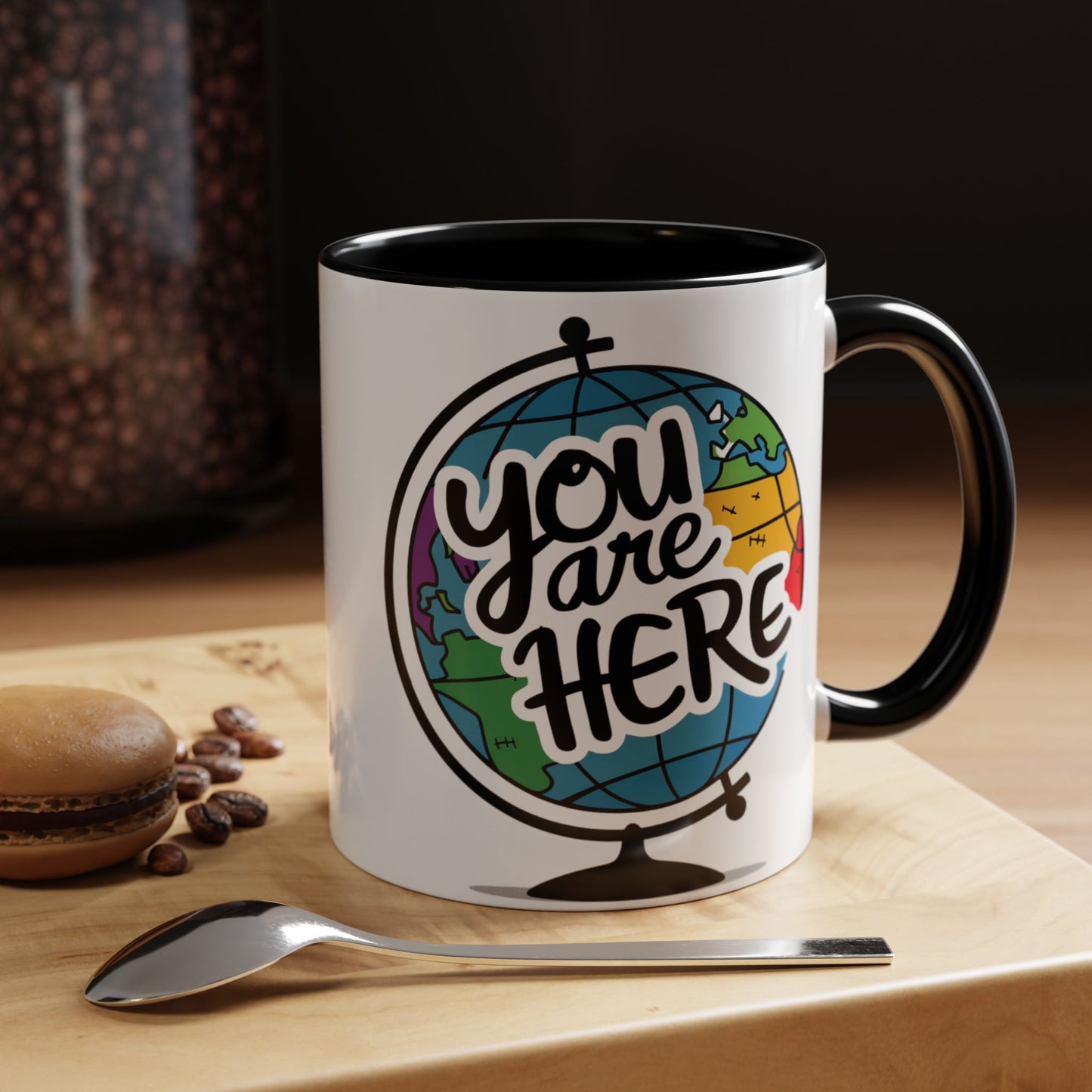 a mug with a picture of a globe with the caption you are here
