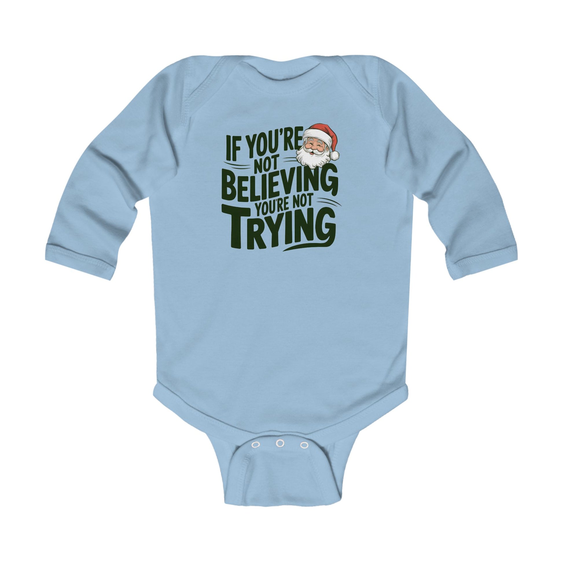 Baby in christmas onesie wearing a If you're not beieving you're not trying Santa fan onesie