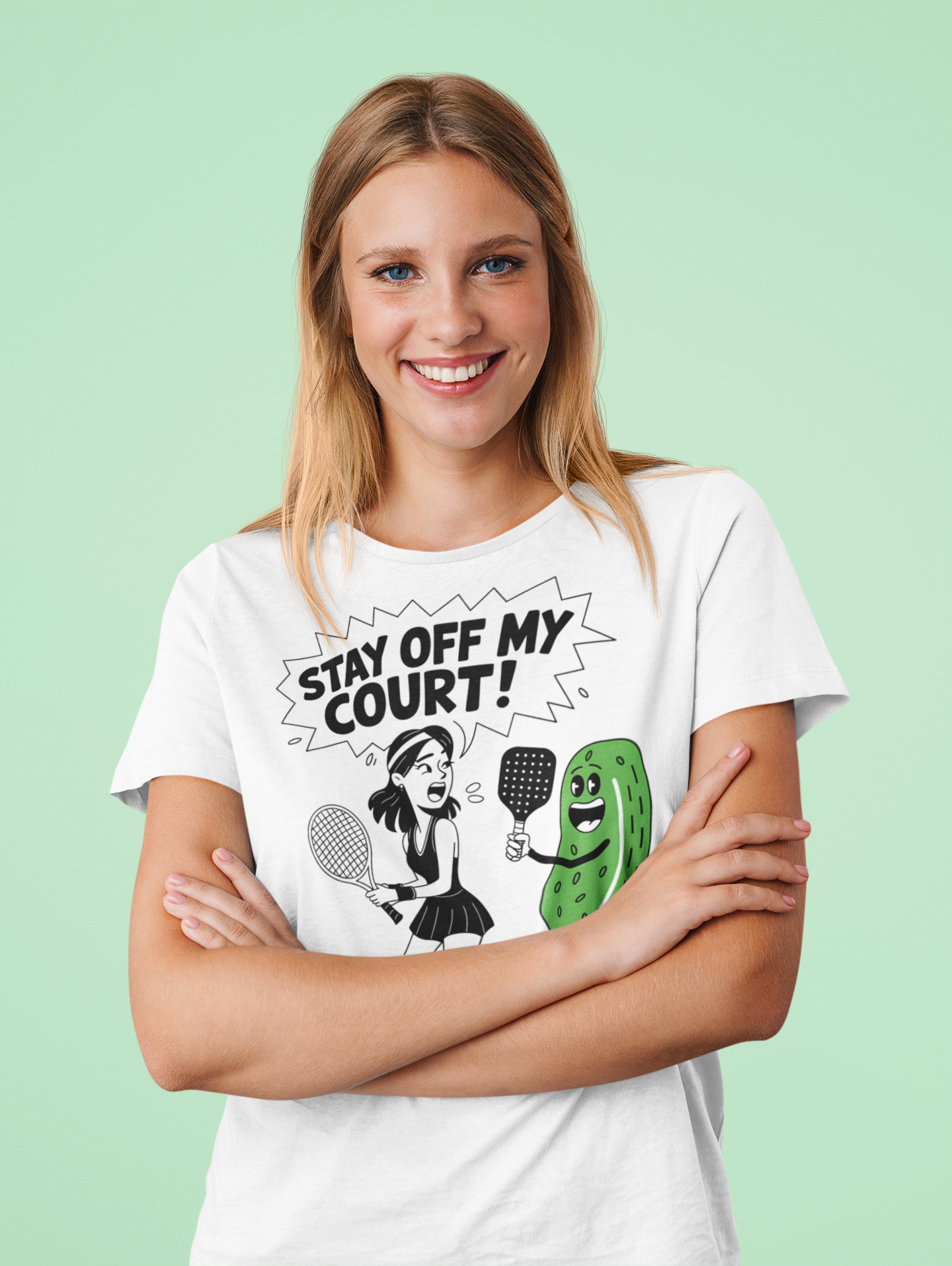 a female tennis player wearing a Stay off my court funny t shirt featuring female tennis player yelling at a pickle ith a pickle raquet