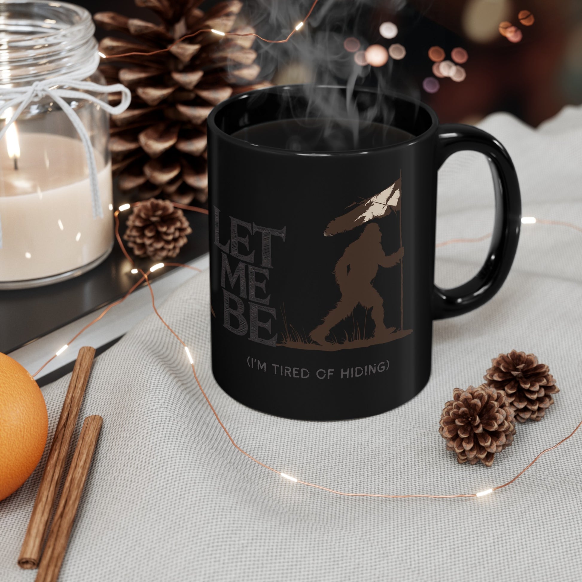 a coffee mug on table bigfoot is roaming the woods with the caption Let Me Be I'm Tired Of Hiding