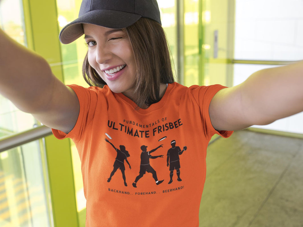 a woman sporting a t shirt with a three stages of ultimate frisbee of people tossing of fundamentals of ultimate frisbee-backhand forehand and beerhand