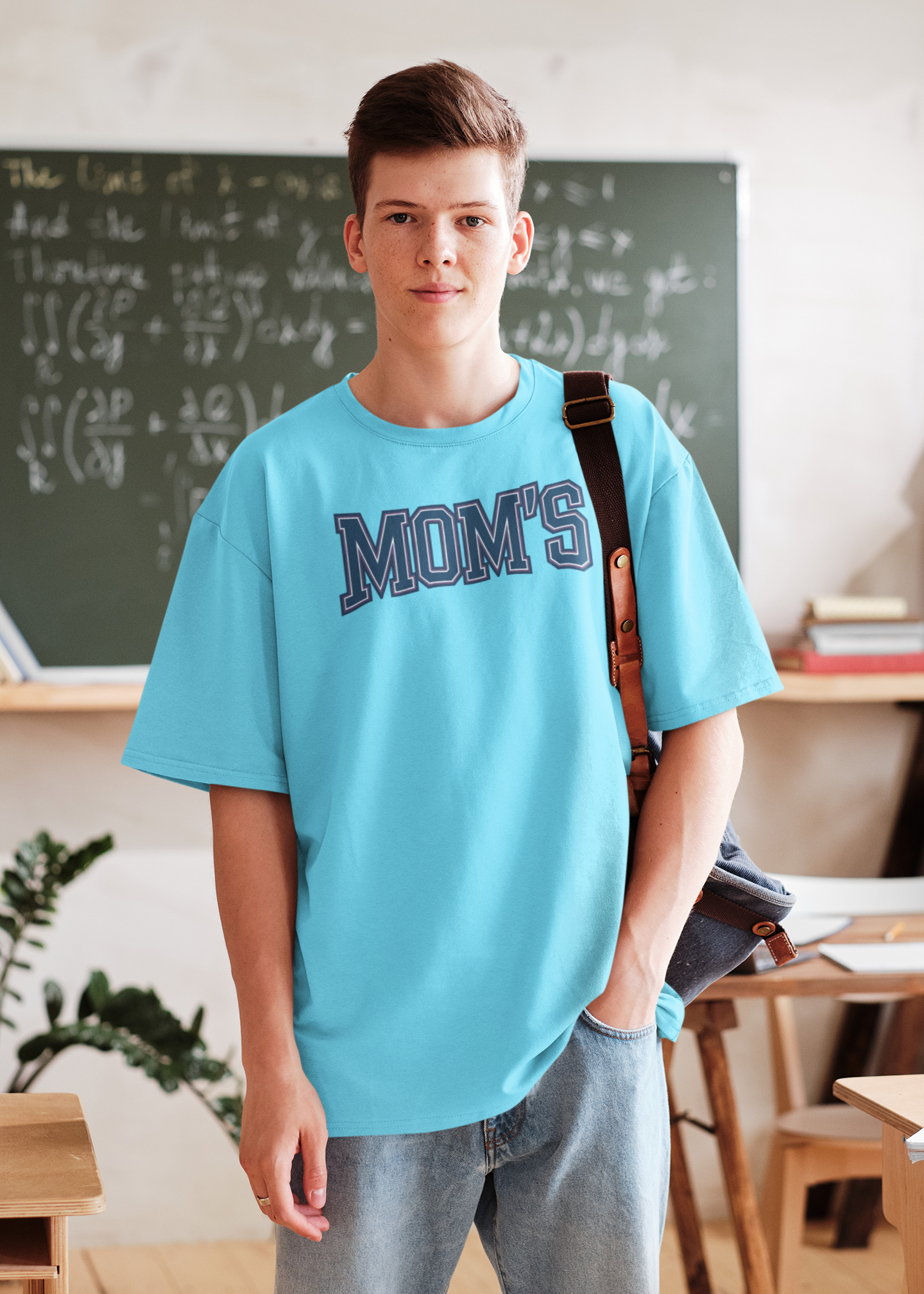 a young man wearing a collegiate style logo with the caption Mom's