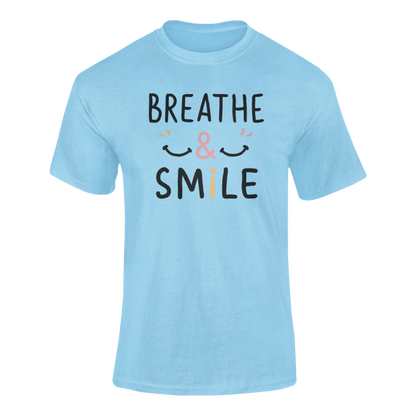 a t shirt with a happy face and the slogan Breathe & Smile