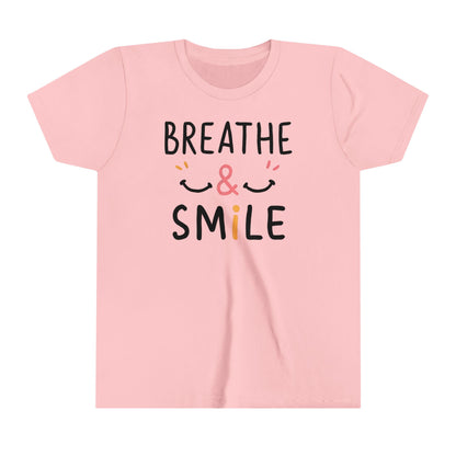  a t-shirt with the caption Breathe & Smile. two smile faces adore the caption