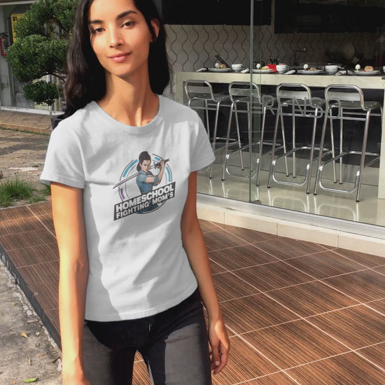 a video displaying young woman wearing a tshirt with a modern woman brandishing a sword with the logo Homeschool Fighing Mom's