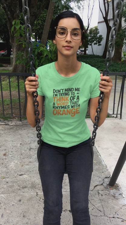 a video of pretty girl on swing wearing a quirky Don't Mind Me I'm thinking Of Orange funny t-shirt