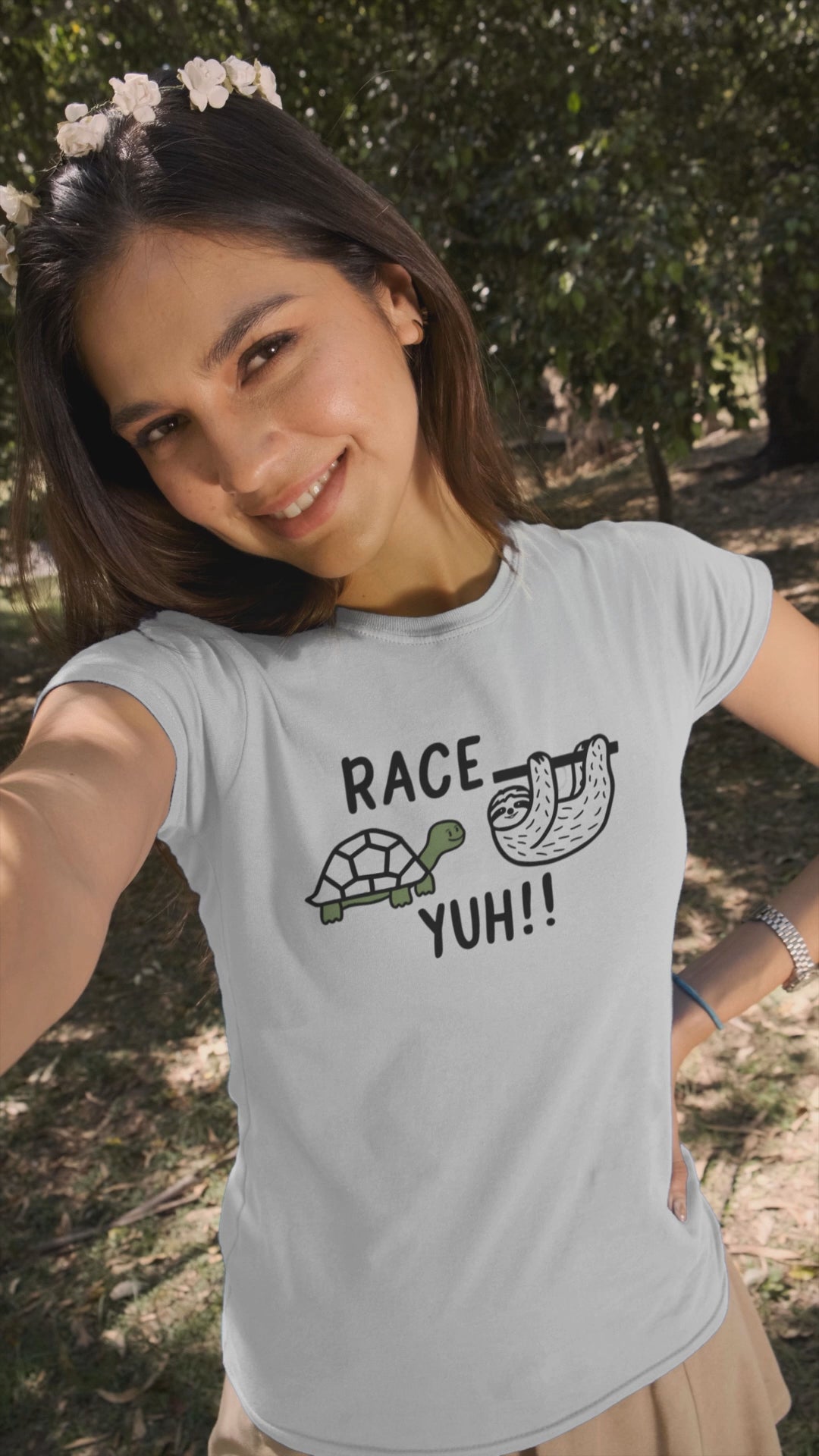 a video with a woman wearing a t shirt with a turtle challenging a sloth to a race with the caption Race Yuh
