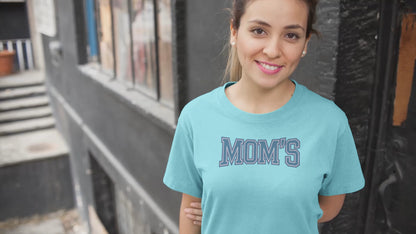 a video with young woman wearing a collegiate style logo with the caption Mom's