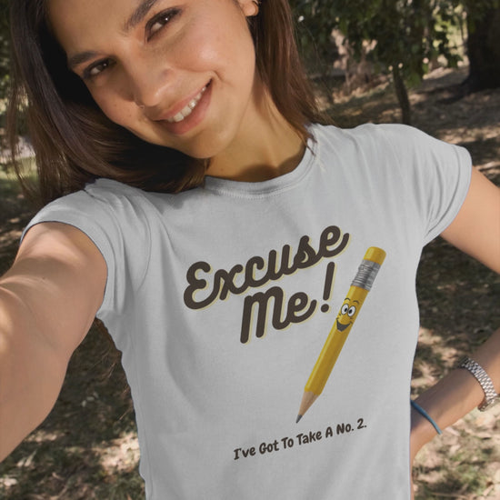 a video of a woman wearing a  t shirt with a yellow pencil with the funny caption Excuse Me I've Got To Take a no.2