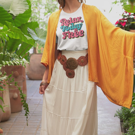 a video with a woman wearing a retro t shirt with the words Relax Today Is Free