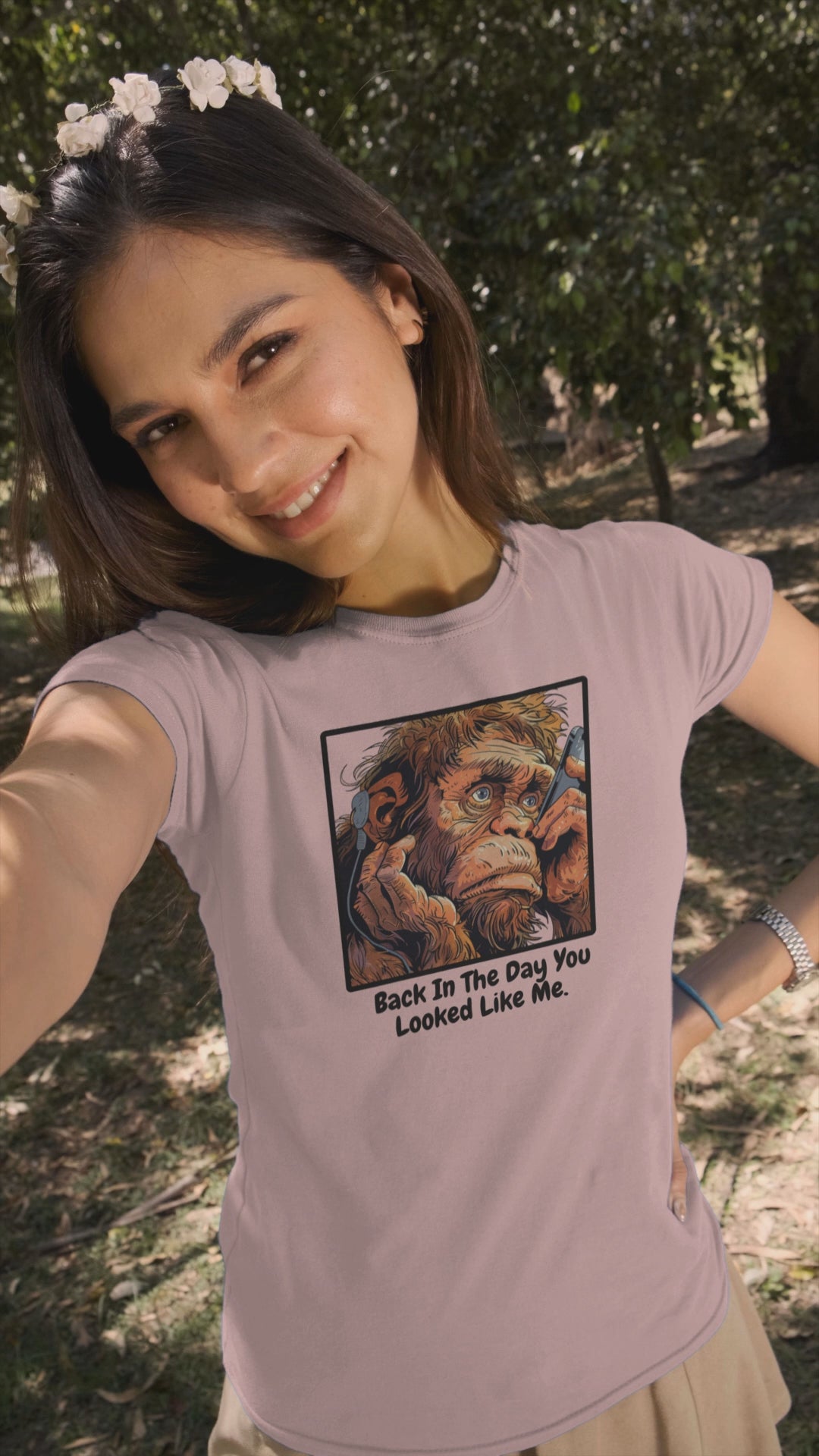 a video of a woman sporting a t shirt of an ape taking a selfie with the funny caption Back In The Day You Looked Like Me