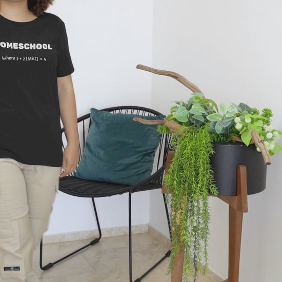 a video with young woman wearing a shirt with logo Homeschool Where 2 + 2 {still} = 4