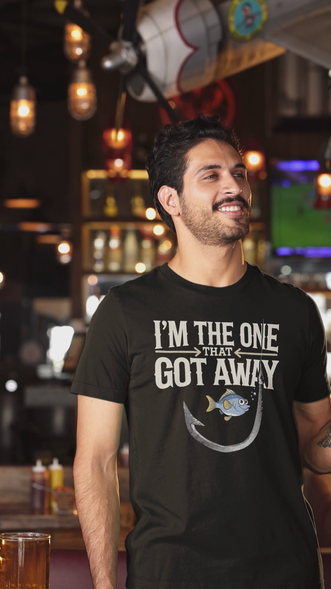 a video of cool man wearing a I'm The One That Got Away Angler Shirt with fish hook