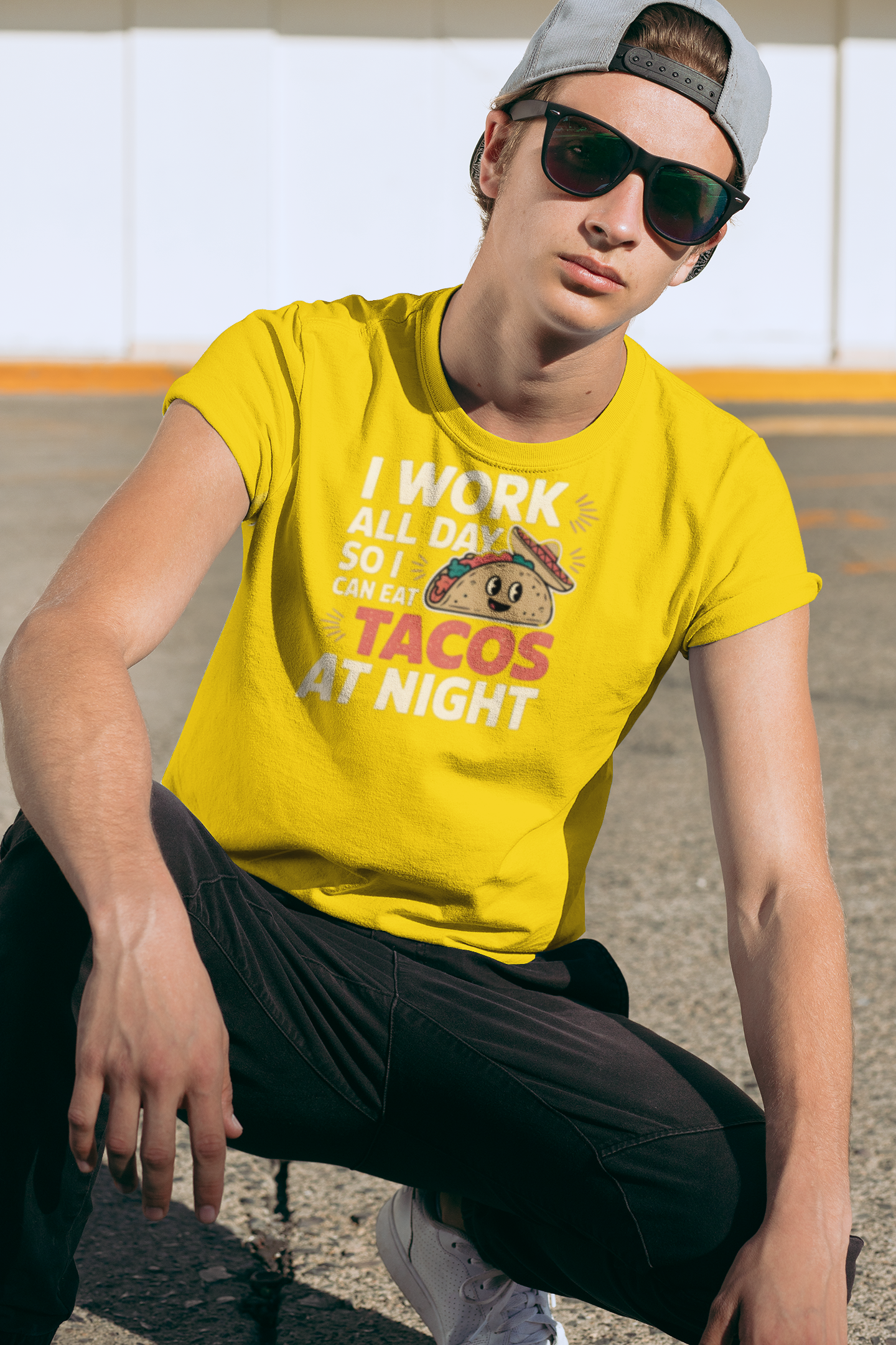 a hip man wearting a I Work All Day So I Can Eat Tacos At Night Taco Tuesday T-Shirt as a gift