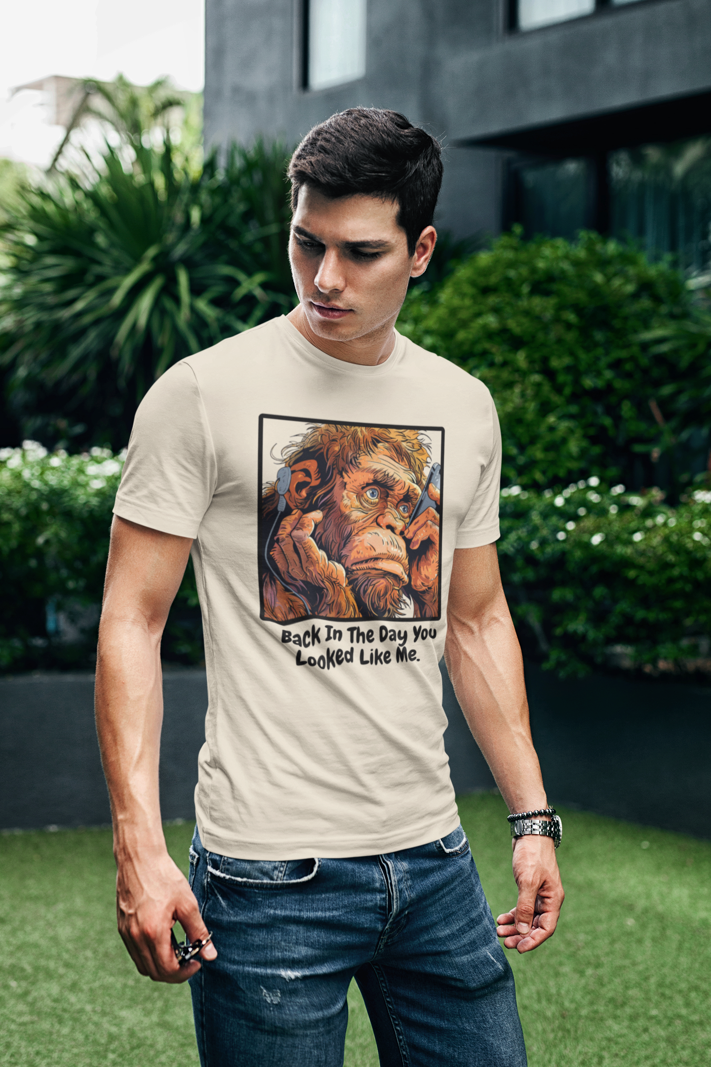 a young man sporting a  t shirt of an ape taking a selfie with the funny caption Back In The Day You Looked Like Me