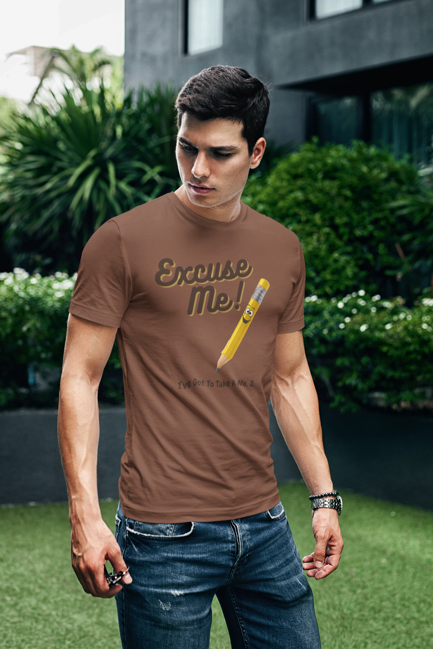 a young man wearing a  t shirt with a yellow pencil with the funny caption Excuse Me I've Got To Take a no.2