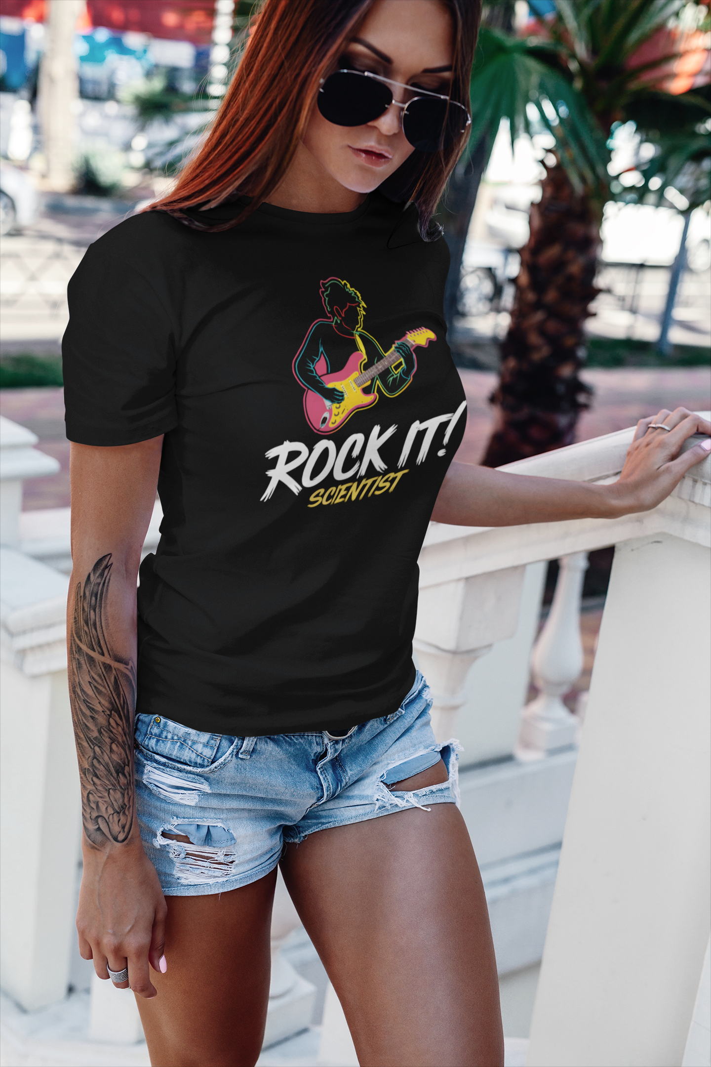 a picture of hip woman wearting A t-shirt with rock star jamming with the slogan Rock It Scientist